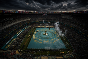 Opening ceremony at Estadio Azteca in Mexico City during the 2026 FIFA World Cup, seen from the upper tier under storm cloud. Sports, GCC Media.