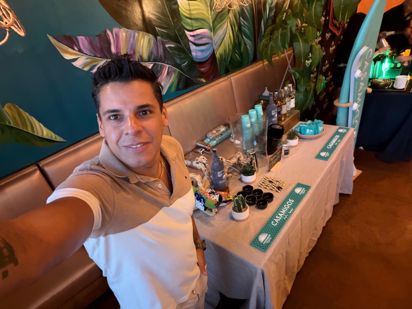 The Casamigos station at a Miami spirits activation, with branded bar mats, glassware and tasting cups set up before service. Hospitality, GCC Media.